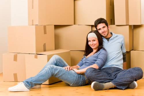 Local movers handling furniture in a Croydon residential street