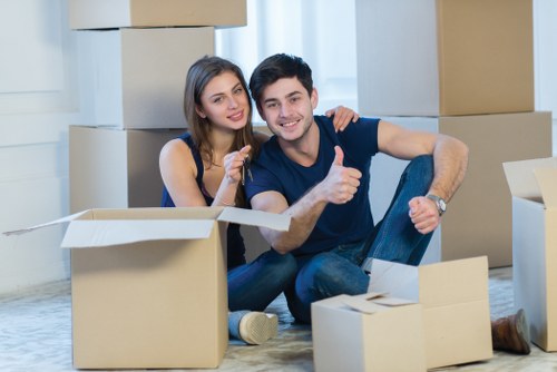 Local moving team loading furniture into a van